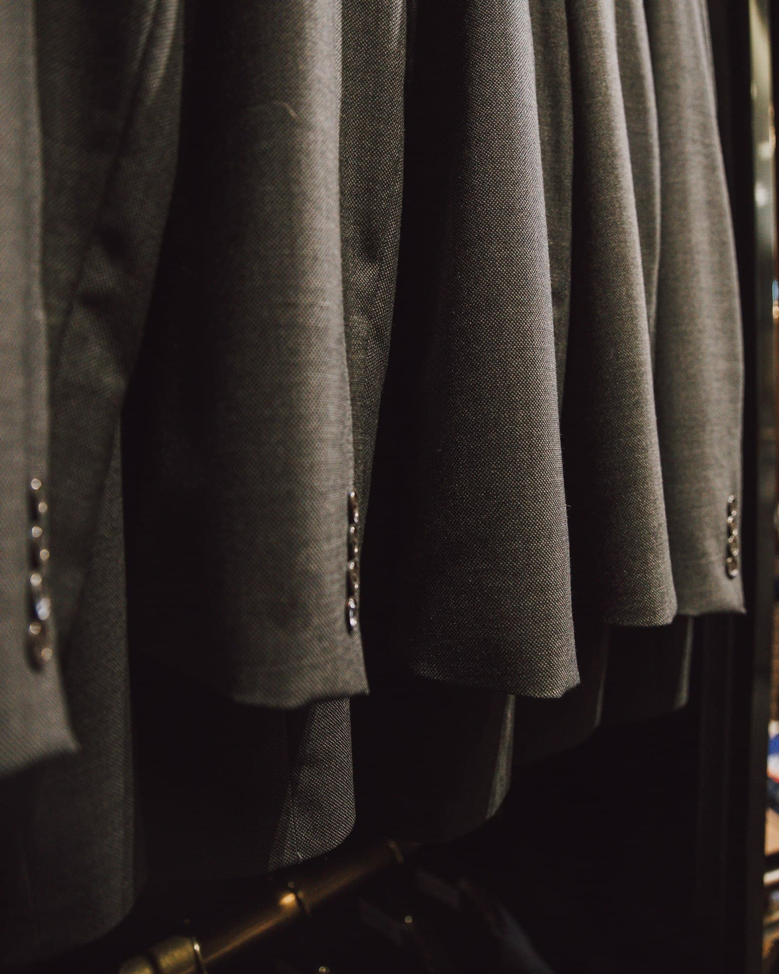 A rail of tailored jackets